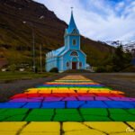No trip to Seyðisfjörður is complete until you are at the foot of the town’s famous Blue Church with the green mountains a a backdrop and the rainbow street leading the way