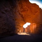 Natural Bridge in Death Valley National Park, A Dramatic, narrow canyon walls framing a bright, sunlit opening