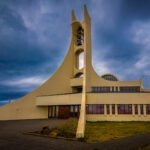 Stykkishólmskirkja is famously nicknamed the "Whale Vertebrae Church" because of its unique, modern architecture — the curved structure resembles the shape of a whale’s backbone or vertebra. The church is built on a small hill, offering panoramic views over the town of Stykkishólmur and Breiðafjörður Bay.