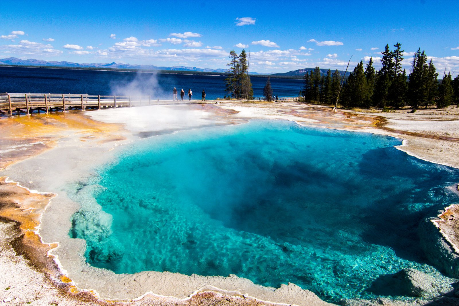 The deep blue and turquoise waters of West Thumb Geyser Basin
