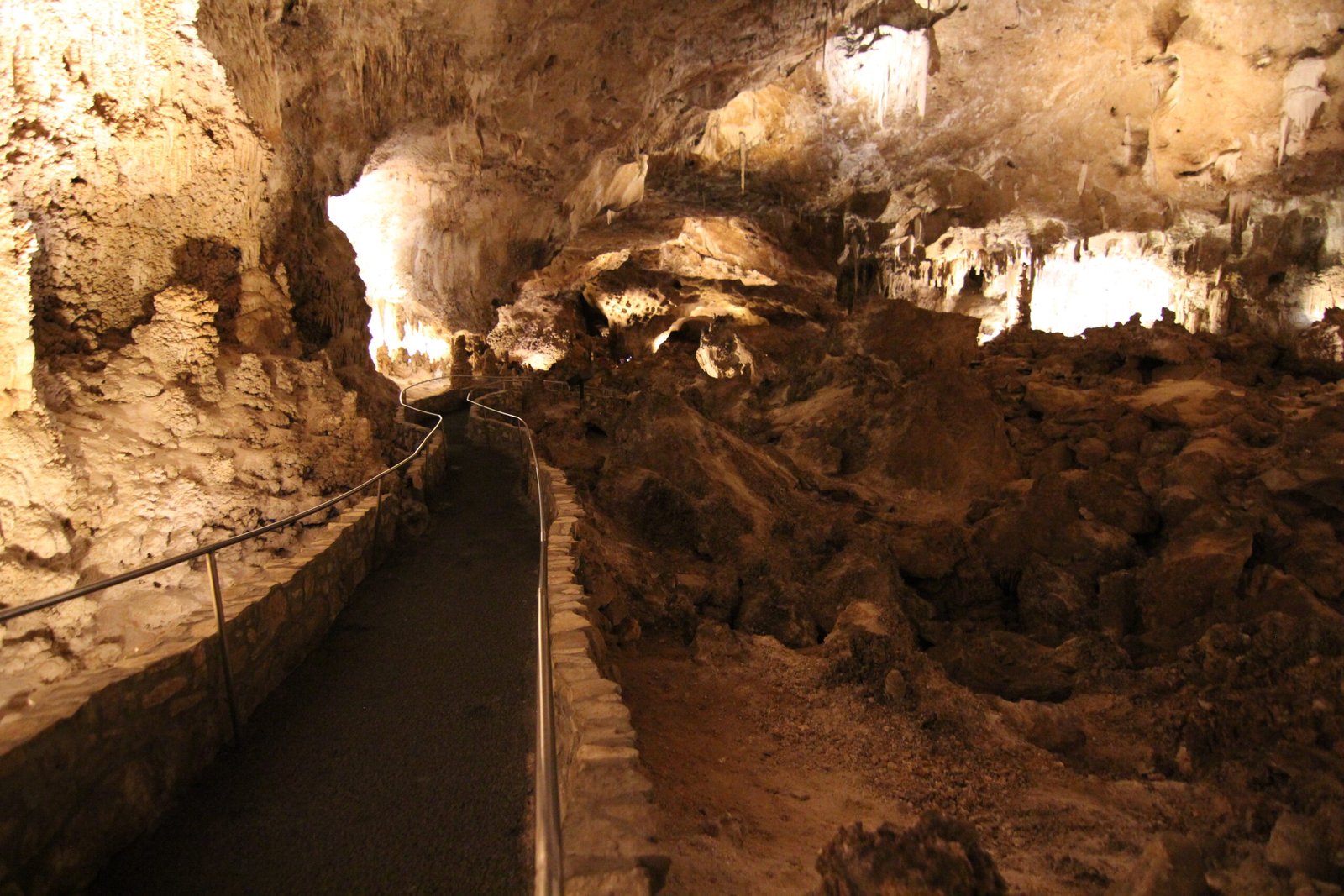 Massive, intricate stalactites and stalagmites create a dense limestone column formation inside Carlsbad Caverns National Park, New Mexico.