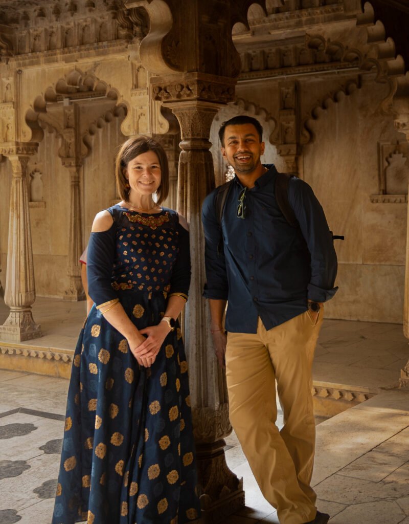 We stepped into a quiet courtyard (Amar Vilas) that felt like a peaceful pause in the middle of it all. Surrounded by beautifully carved pillars on one side and shaded by trees on the other, the space felt open, calm, and refreshing.