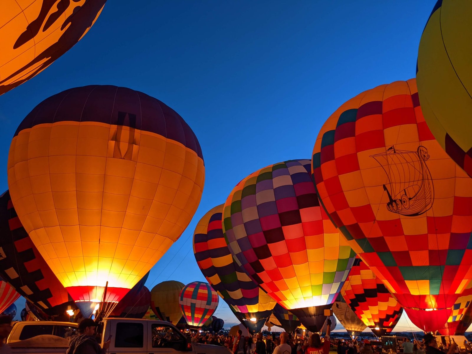 Vibrant hot air balloons glowing at the Albuquerque International Balloon Fiesta